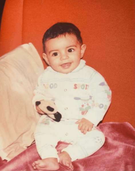 me holding a little panda plushie